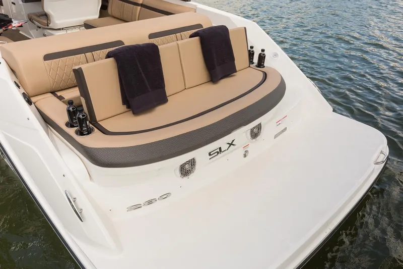 Slide: The Image of Manufacturer Provided Image: 2018 Sea Ray SLX 280 boat with tan seating and black accents on the water. - 12