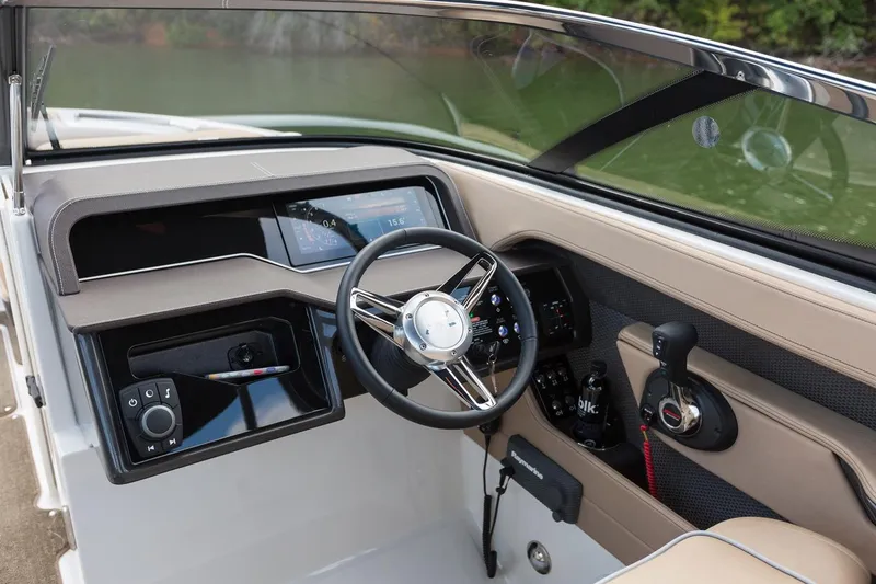 Slide: The Image of Manufacturer Provided Image: 2018 Sea Ray SLX 280 boat dashboard with steering wheel and control panel. - 7