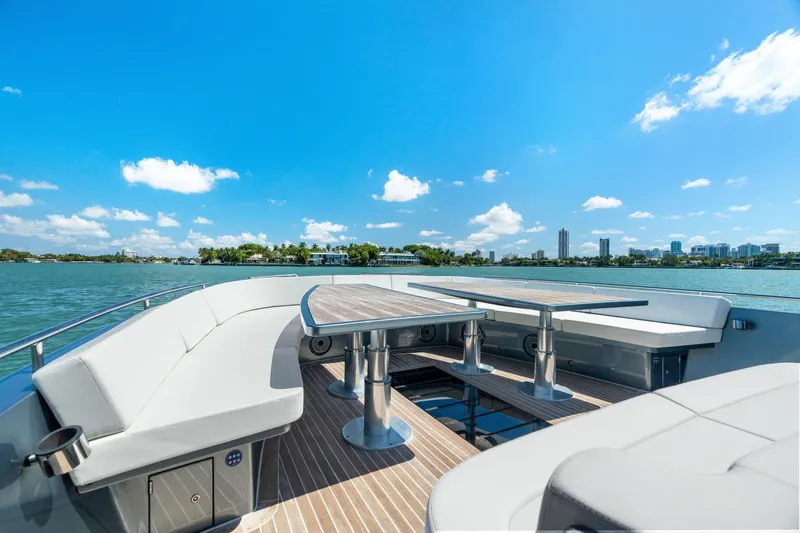 Slide: The Image of Luxurious 2024 CNM CONTINENTAL 54 SuperSport yacht deck with scenic waterfront view. - 45
