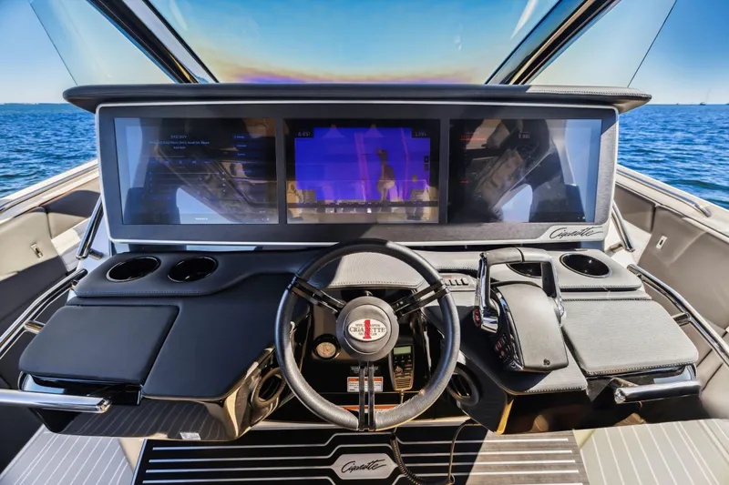 Slide: The Image of 2022 Cigarette 42 Auroris boat dashboard with advanced navigation screens and controls. - 3