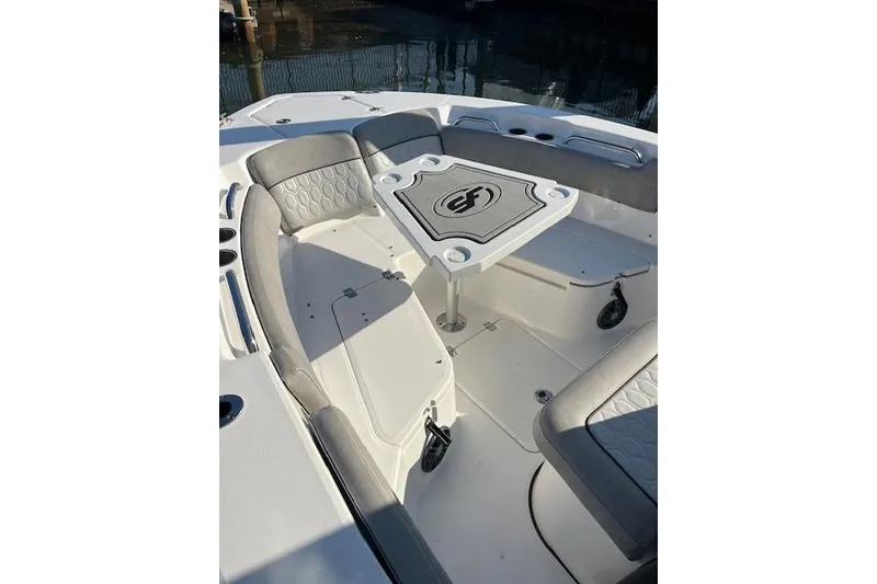 Slide: The Image of 2021 Sea Fox 228 Commander boat interior with seating and table setup. - 10