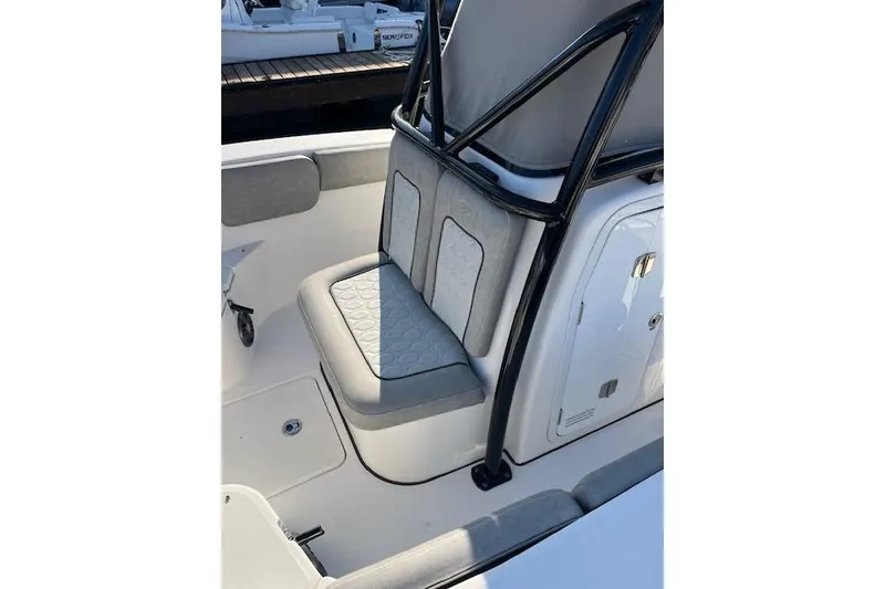 Slide: The Image of 2021 Sea Fox 228 Commander boat interior with cushioned seating and storage. - 11