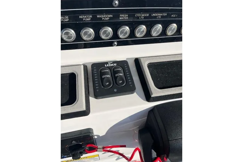 Slide: The Image of Control panel of a 2021 Sea Fox 228 Commander boat with Lenco trim tab switches. - 19