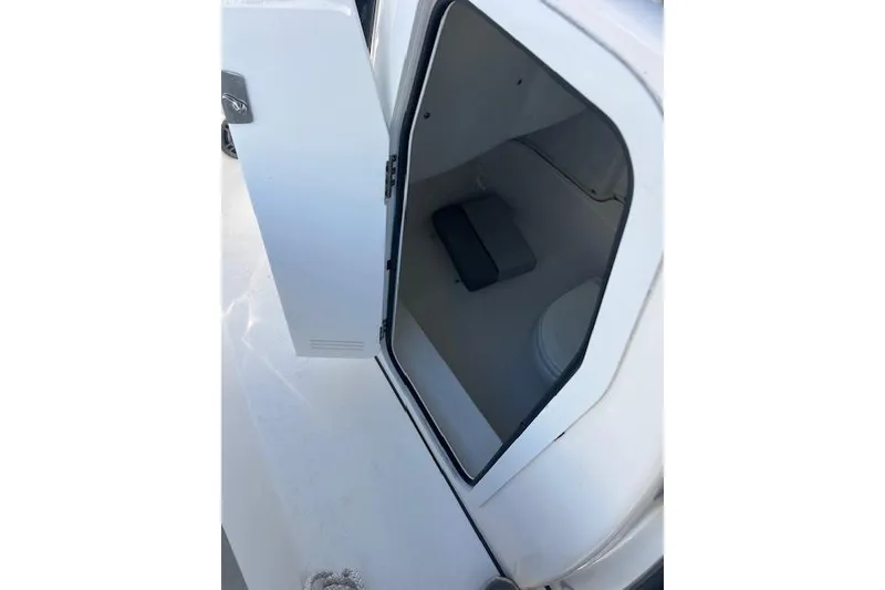 Slide: The Image of Open storage compartment on 2021 Sea Fox 228 Commander boat. - 26