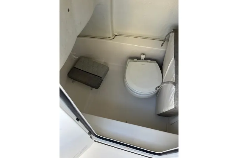 Slide: The Image of Interior of 2021 Sea Fox 228 Commander boat with compact toilet and storage. - 27