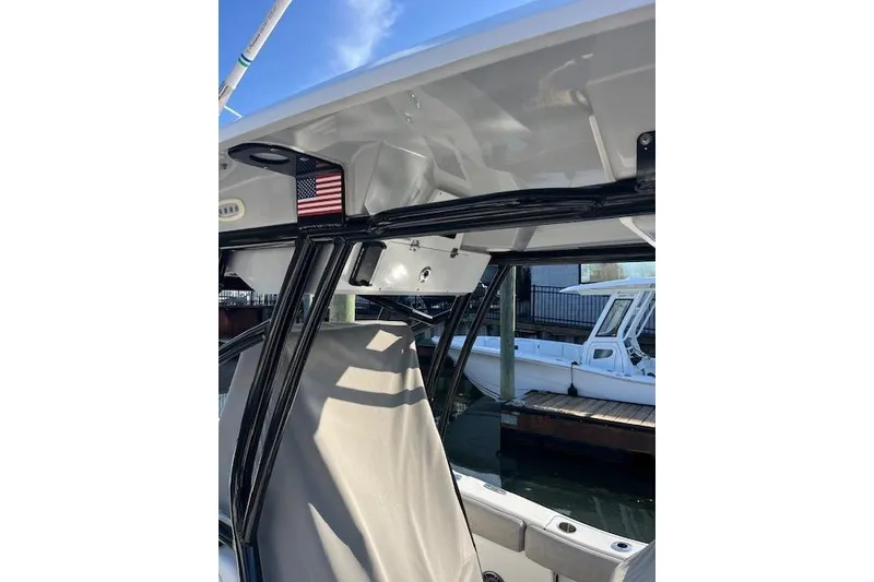 Slide: The Image of 2021 Sea Fox 228 Commander boat interior with American flag detail. - 7