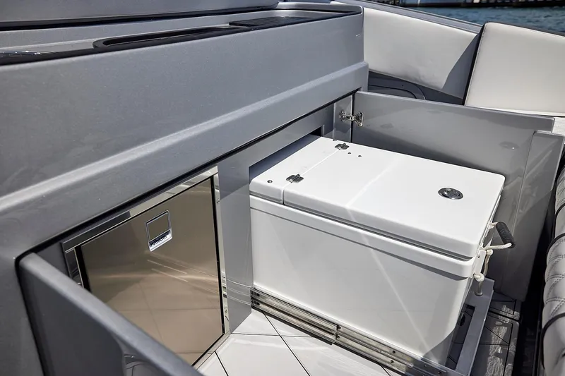 Slide: The Image of 2022 Midnight Express 43 Open yacht interior with built-in cooler and storage compartment. - 23