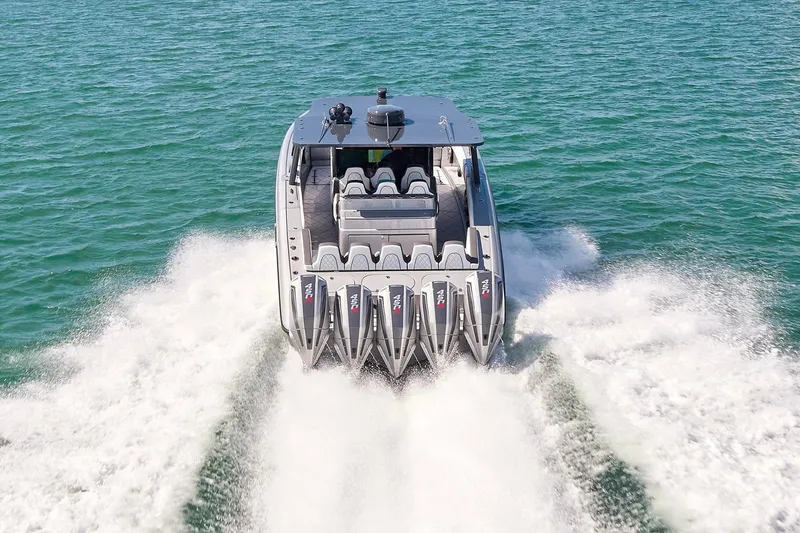 Slide: The Image of 2022 Midnight Express 43 Open boat speeding on water with powerful engines. - 10