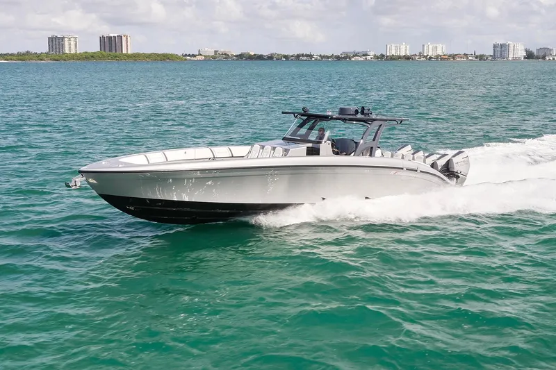 Slide: The Image of 2022 Midnight Express 43 Open boat cruising on clear blue water. - 2