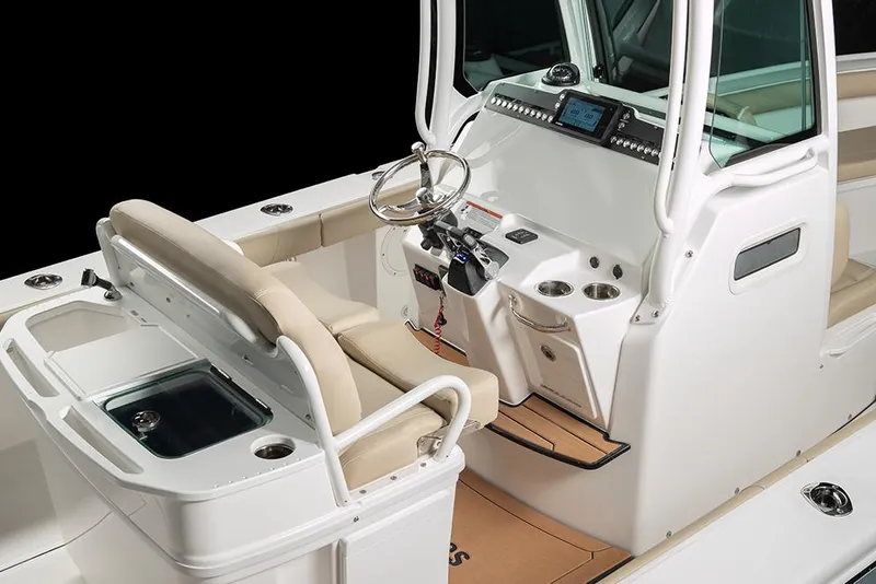 Slide: The Image of Manufacturer Provided Image: 2025 Everglades 273 Center Console boat interior with helm and seating. - 10