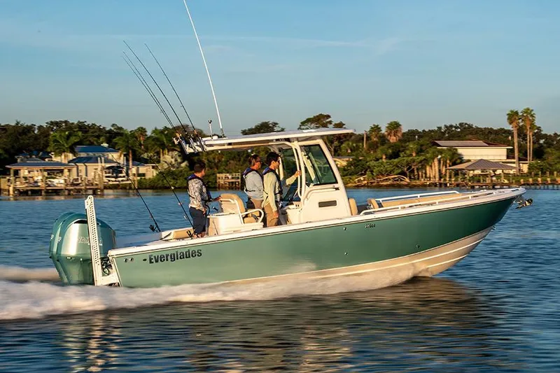 Slide: The Image of Manufacturer Provided Image: 2025 Everglades 273 Center Console boat cruising on a sunny day. - 2