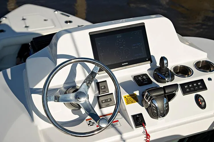 Slide: The Image of Manufacturer Provided Image: 2025 Everglades 273 Center Console helm with steering wheel and navigation display. - 7