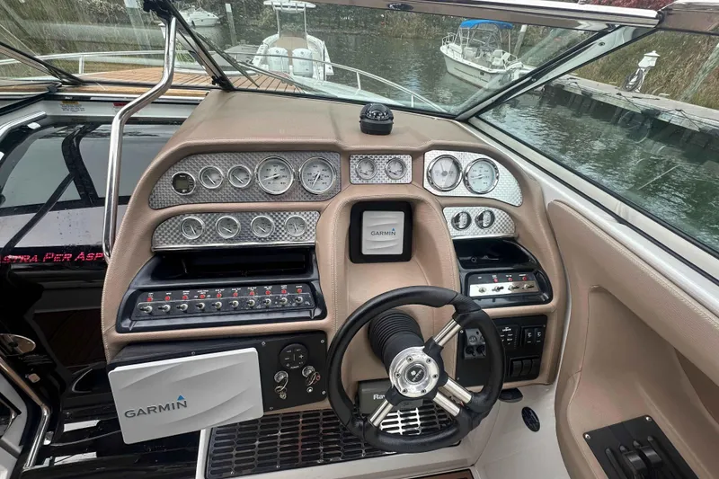 Slide: The Image of Cockpit of a 2008 Cobalt 323 boat with Garmin navigation system and control panel. - 10