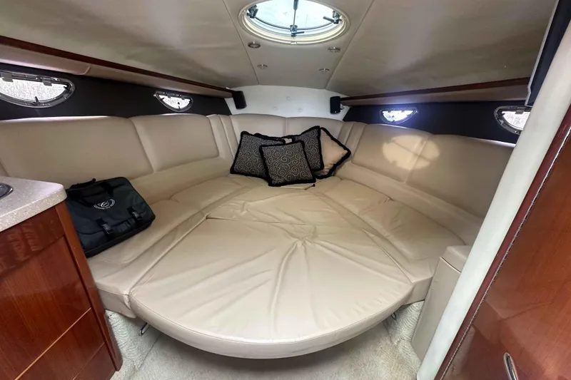 Slide: The Image of Luxurious interior cabin of a 2008 Cobalt 323 boat with plush seating and cushions. - 13