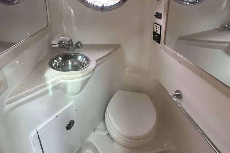 Slide: The Image of Compact bathroom in a 2008 Cobalt 323 boat with sink and toilet. - 16