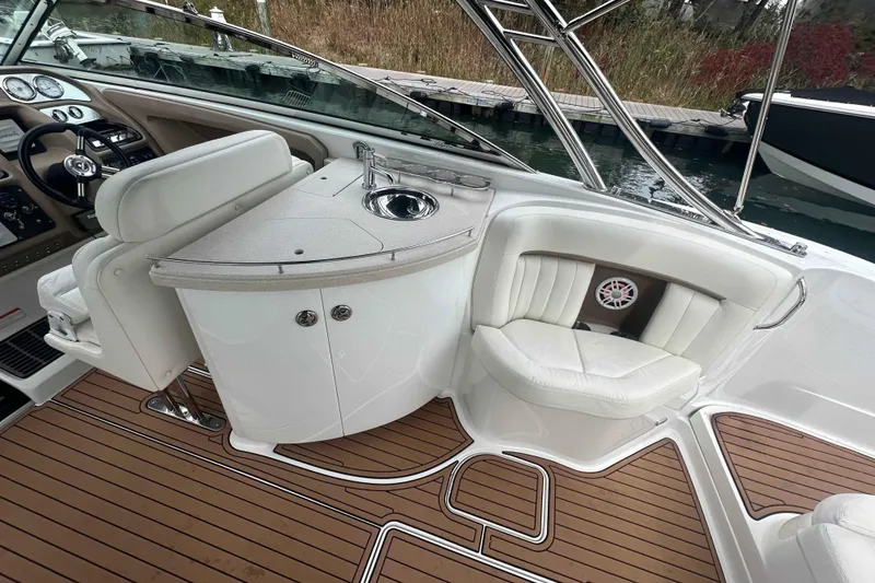Slide: The Image of Luxurious interior of a 2008 Cobalt 323 boat with seating and sink. - 9