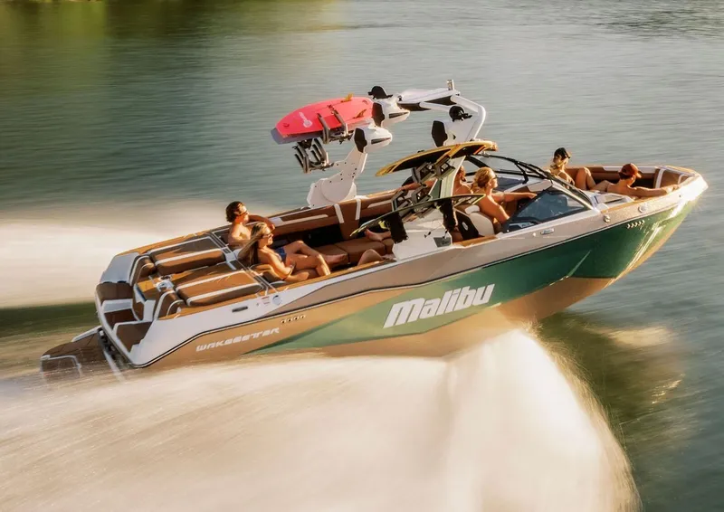 Slide: The Image of Manufacturer Provided Image: 2026 Malibu Wakesetter 25 LSV speeding on water with passengers enjoying the ride. - 11