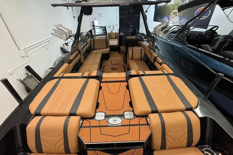 Slide: The Image of 2026 Malibu Wakesetter 25 LSV interior with luxurious tan and black seating. - 5