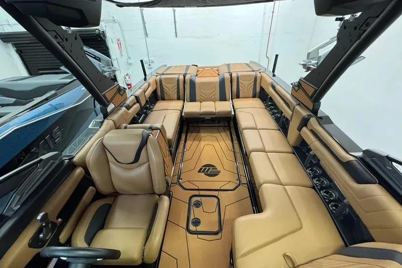 Slide: The Image of Luxurious interior of 2026 Malibu Wakesetter 25 LSV boat with tan leather seating. - 9