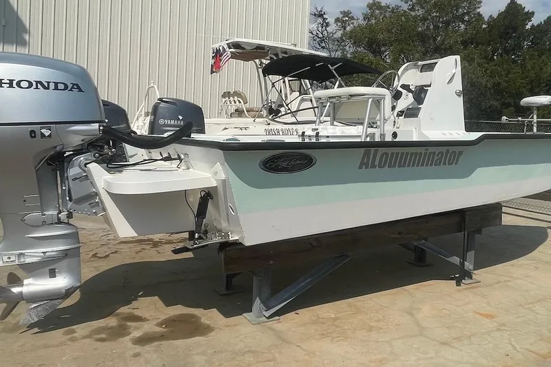 Slide: The Image of 2014 Lifetyme 2070 boat with Honda and Yamaha engines on display. - 2