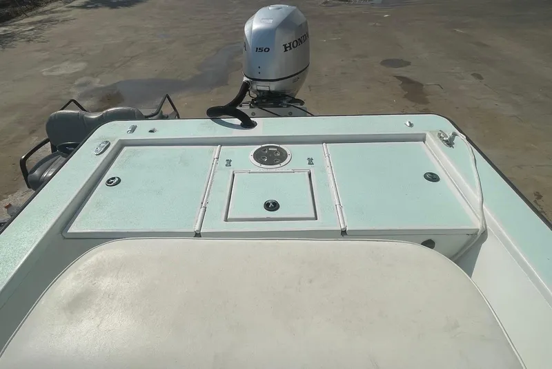 Slide: The Image of 2014 Lifetyme 2070 boat with Honda 150 outboard motor on a concrete surface. - 9