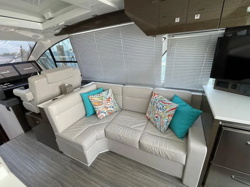 Slide: The Image of Luxurious interior of 2019 Cruisers 50 Cantius yacht with modern seating and colorful cushions. - 11