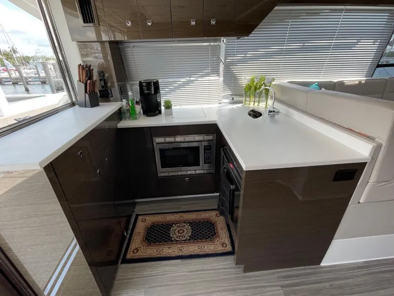Slide: The Image of Modern kitchen in 2019 Cruisers 50 Cantius yacht with sleek countertops and appliances. - 13