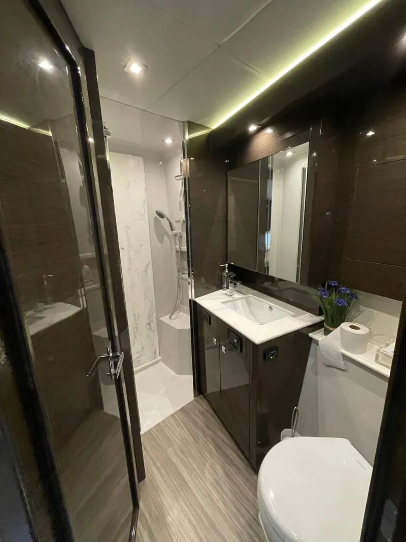 Slide: The Image of Luxurious bathroom in 2019 Cruisers 50 Cantius yacht with modern fixtures and elegant design. - 22