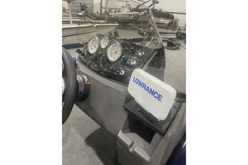 Slide: The Image of 2021 Tracker Pro 170 boat dashboard with Lowrance fish finder and gauges. - 28