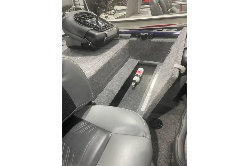 Slide: The Image of 2021 Tracker Pro 170 boat interior with storage compartment and fire extinguisher. - 31