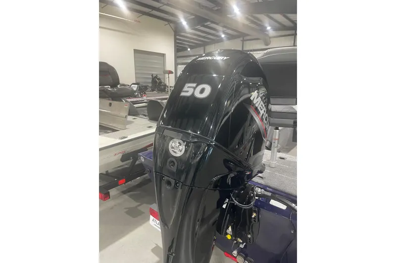 Slide: The Image of 2021 Tracker Pro 170 boat with Mercury 50 outboard motor in showroom. - 4