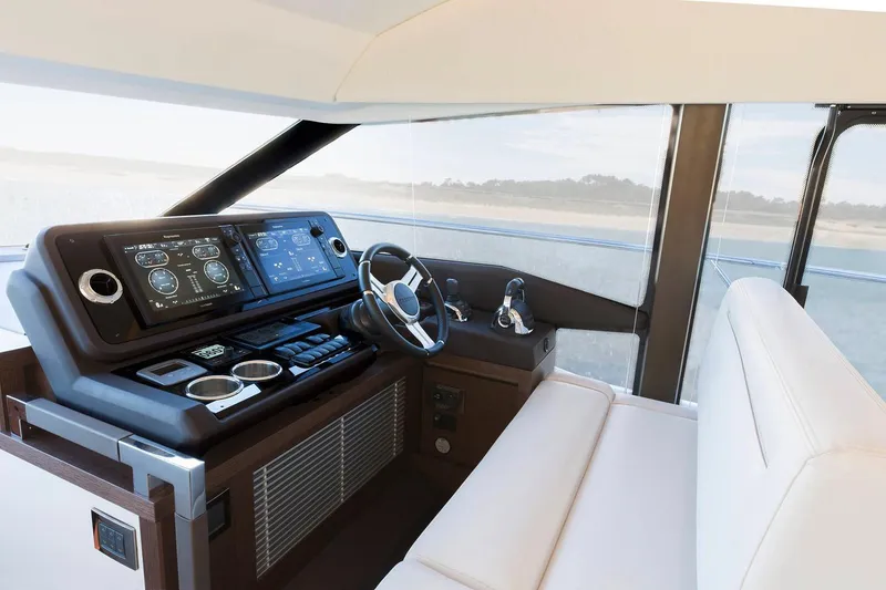 Slide: The Image of Manufacturer Provided Image: 2023 Prestige 520 yacht helm station with modern navigation systems and luxurious seating. - 20