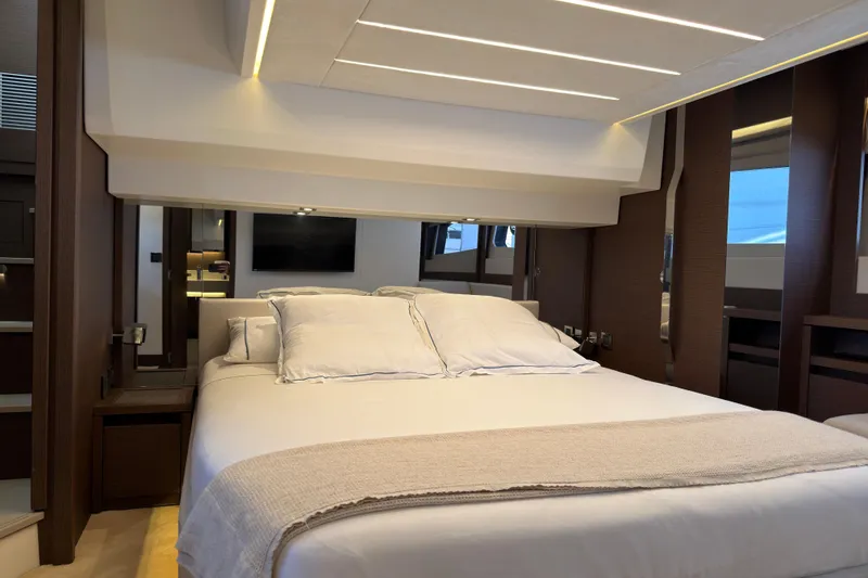 Slide: The Image of Luxurious bedroom in Prestige 520 yacht, 2023 model. - 9