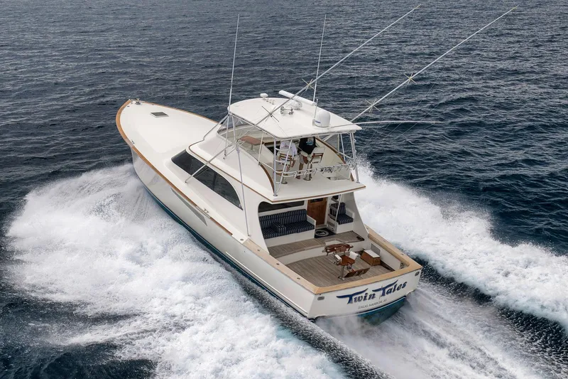 Slide: The Image of 1999 Hines-Farley SPORTFISHERMAN yacht cruising on open water. - 16