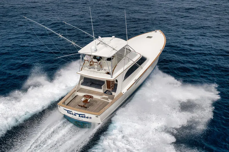 Slide: The Image of 1999 Hines-Farley SPORTFISHERMAN yacht cruising swiftly on open ocean waters. - 19