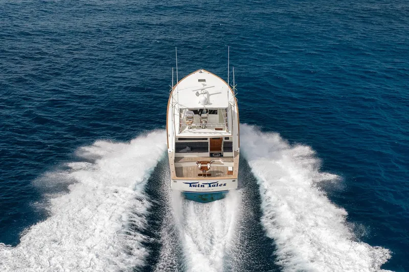 Slide: The Image of 1999 Hines-Farley SPORTFISHERMAN yacht cruising on open blue sea, aerial view. - 21