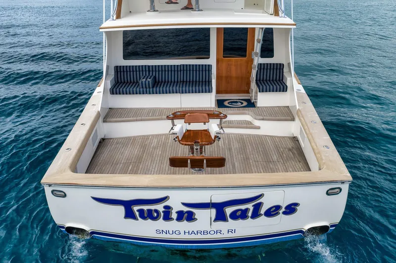 Slide: The Image of 1999 Hines-Farley SPORTFISHERMAN boat "Twin Tales" on water, rear view, Snug Harbor, RI. - 24