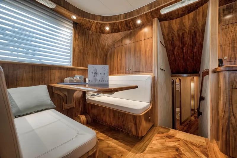 Slide: The Image of Luxurious 1999 Hines-Farley SPORTFISHERMAN yacht interior with elegant wood finish and cozy seating area. - 27