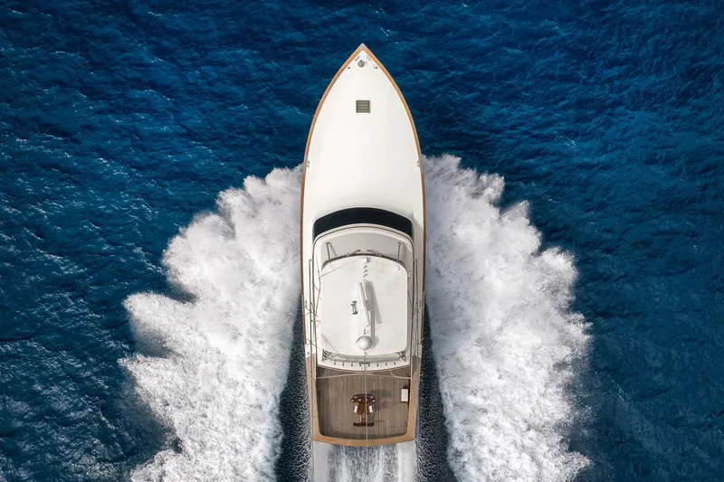 Slide: The Image of Overhead view of 1999 Hines-Farley SPORTFISHERMAN yacht cruising through blue ocean waters. - 3