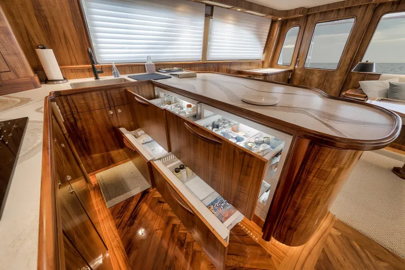 Slide: The Image of Luxurious 1999 Hines-Farley SPORTFISHERMAN yacht interior with elegant wood cabinetry and modern amenities. - 30