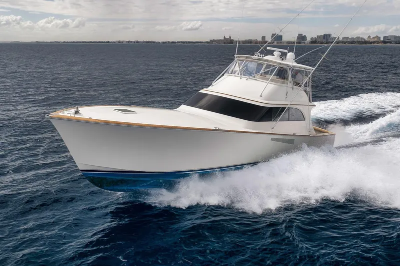 Slide: The Image of 1999 Hines-Farley SPORTFISHERMAN yacht cruising on open ocean waters. - 4
