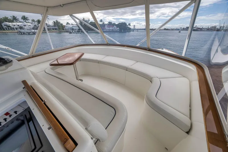 Slide: The Image of Luxurious 1999 Hines-Farley SPORTFISHERMAN yacht interior with white seating and ocean view. - 43