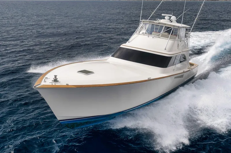 Slide: The Image of 1999 Hines-Farley SPORTFISHERMAN yacht cruising swiftly on open ocean waters. - 6