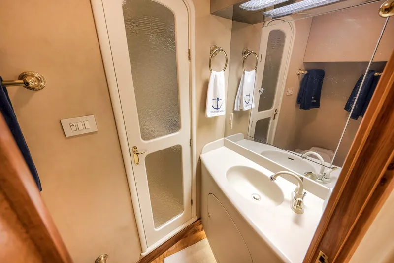 Slide: The Image of Luxurious bathroom interior of 1999 Hines-Farley SPORTFISHERMAN yacht with elegant fixtures. - 61