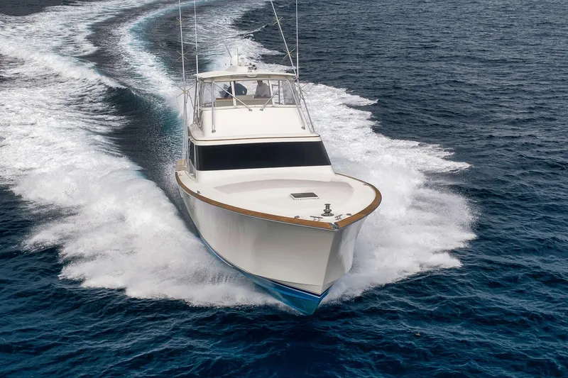 Slide: The Image of 1999 Hines-Farley SPORTFISHERMAN yacht cruising swiftly on open ocean waters. - 7