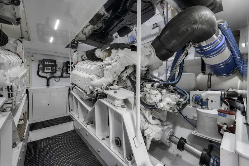 Slide: The Image of Engine room of 1999 Hines-Farley SPORTFISHERMAN yacht, featuring MAN engines and advanced machinery. - 71