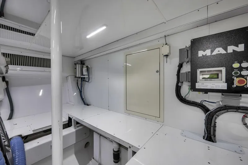 Slide: The Image of Engine room of 1999 Hines-Farley SPORTFISHERMAN with MAN control panel and wiring. - 73