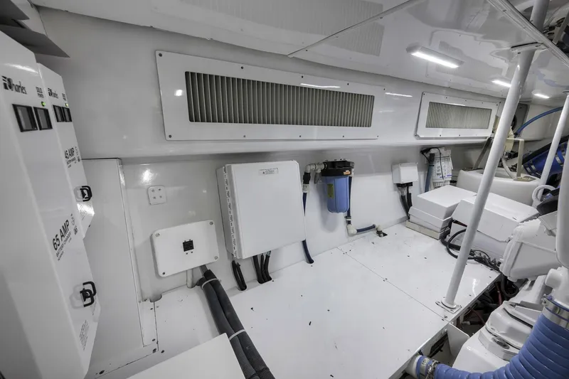 Slide: The Image of Engine room of 1999 Hines-Farley SPORTFISHERMAN with electrical panels and ventilation system. - 75
