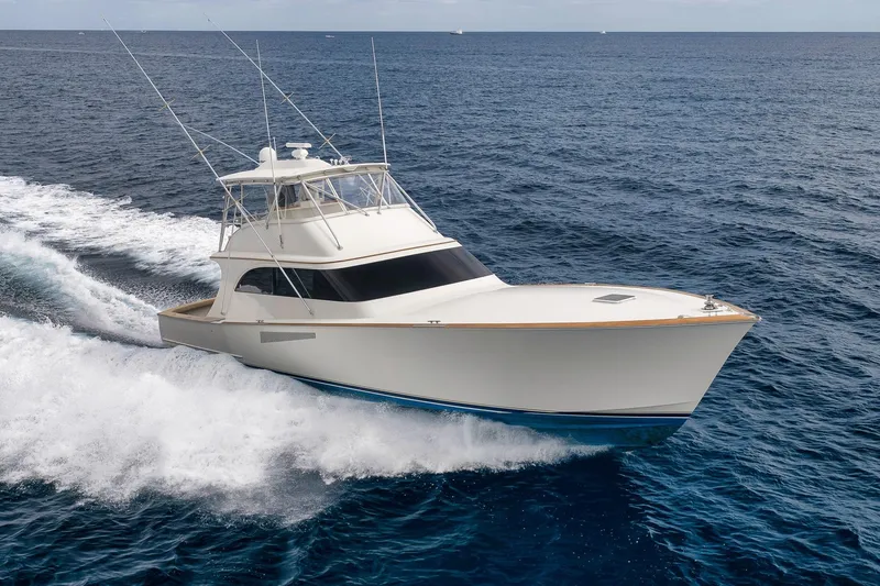 Slide: The Image of 1999 Hines-Farley SPORTFISHERMAN yacht cruising on open ocean waters. - 8