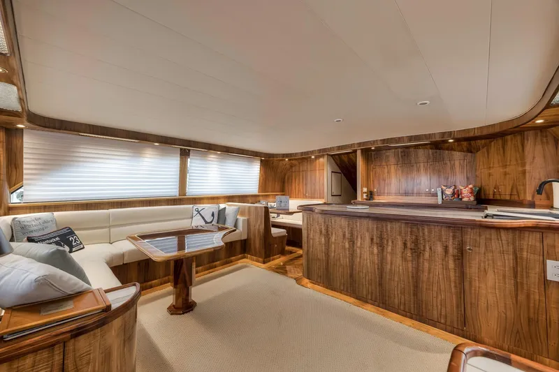 Slide: The Image of Luxurious 1999 Hines-Farley SPORTFISHERMAN yacht interior with elegant wood finish and cozy seating. - 83